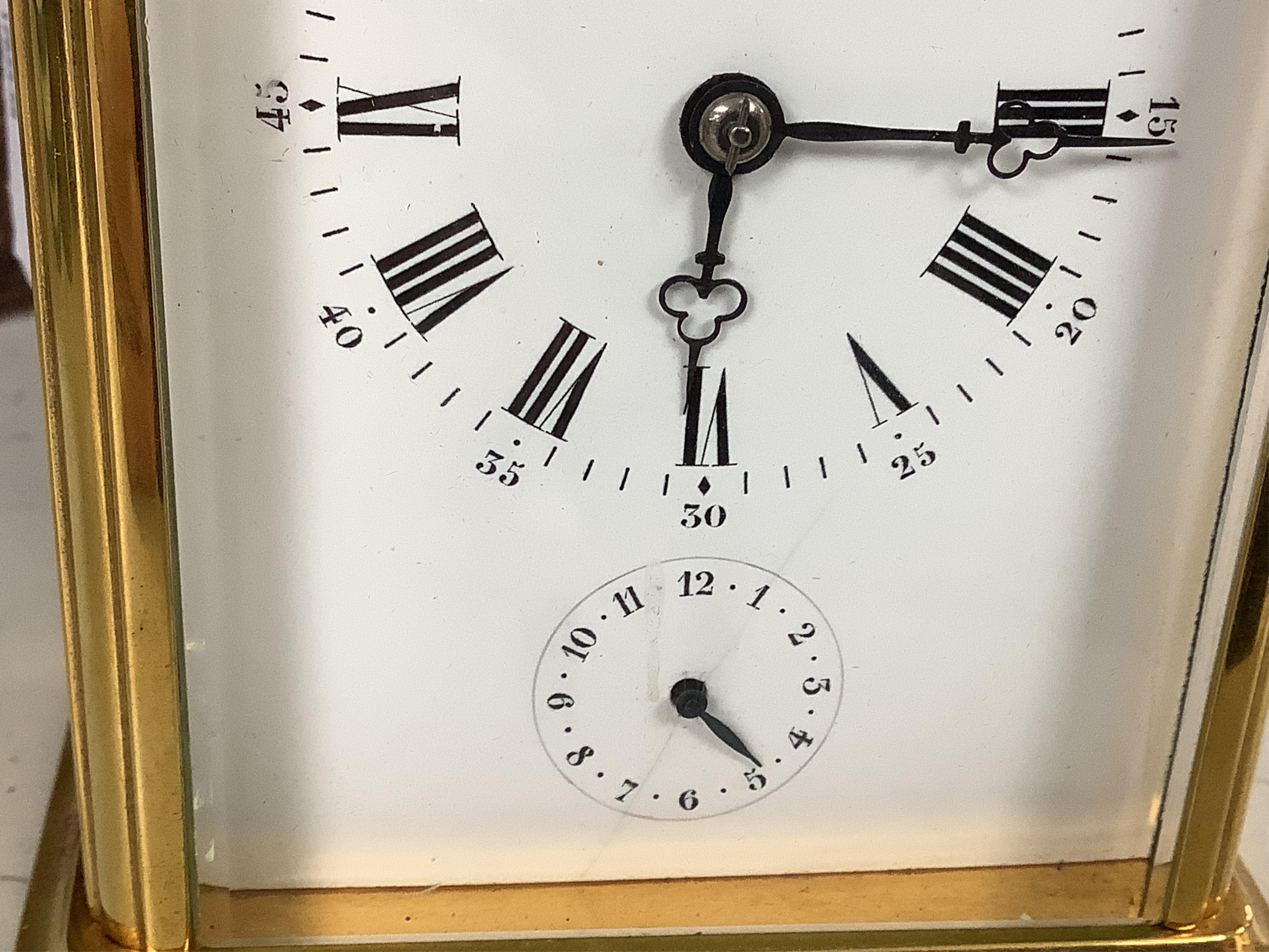 A French carriage clock with alarm, gong-striking movement, in a contemporary leather case, 17cm high